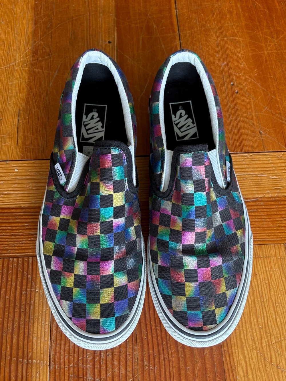 Vans Checkerboard Slip-On Sneakers in Black with Rainbow Accents